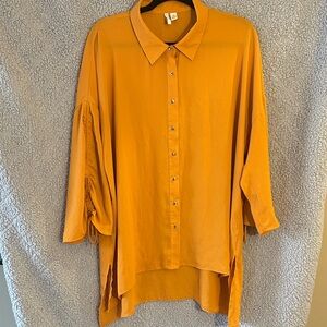 Elegant High/Low Women's Button-Down Shirt in a Mustard Orange